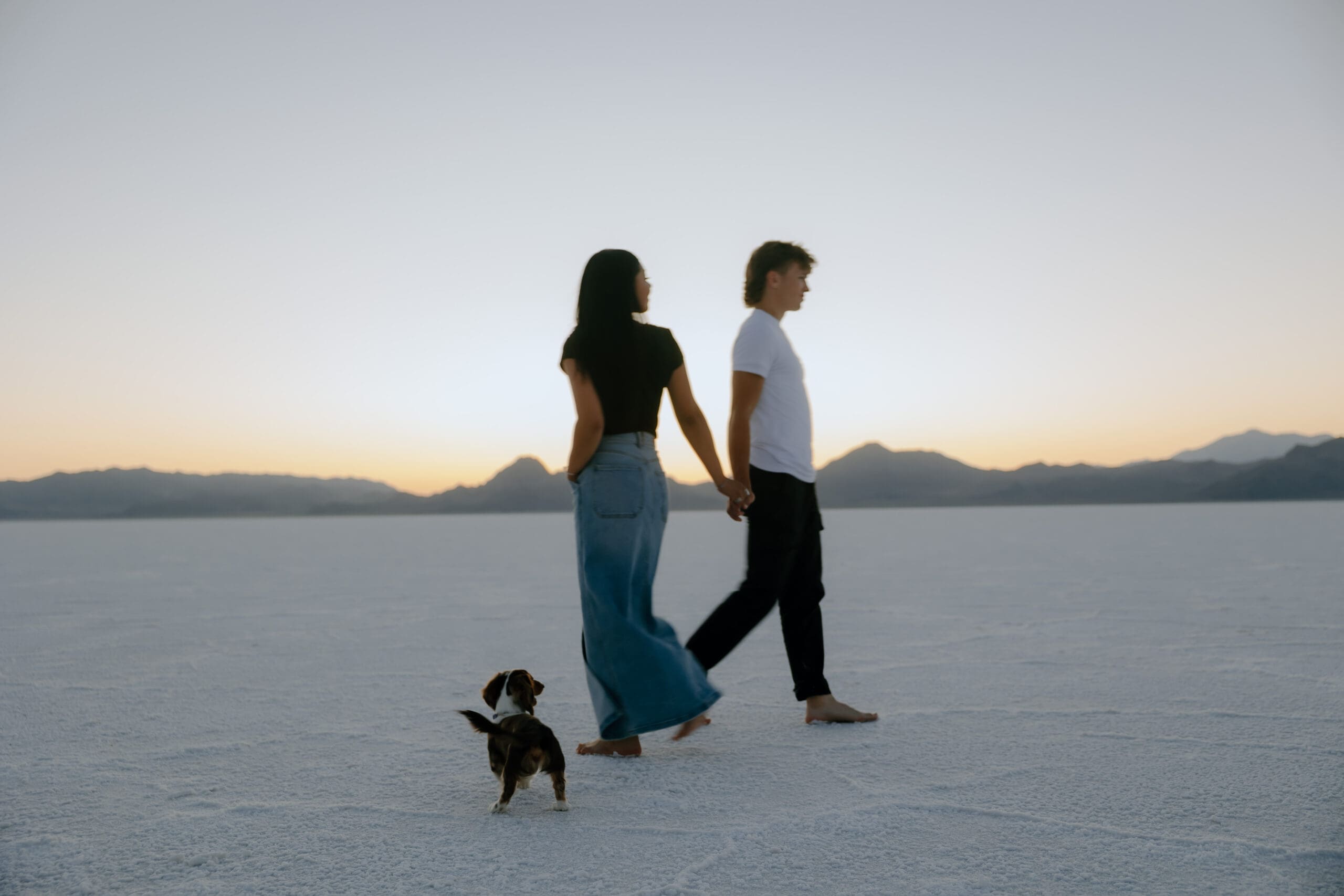 couple pose in the Salt Flats during their Southern Utah engagement photoshoot