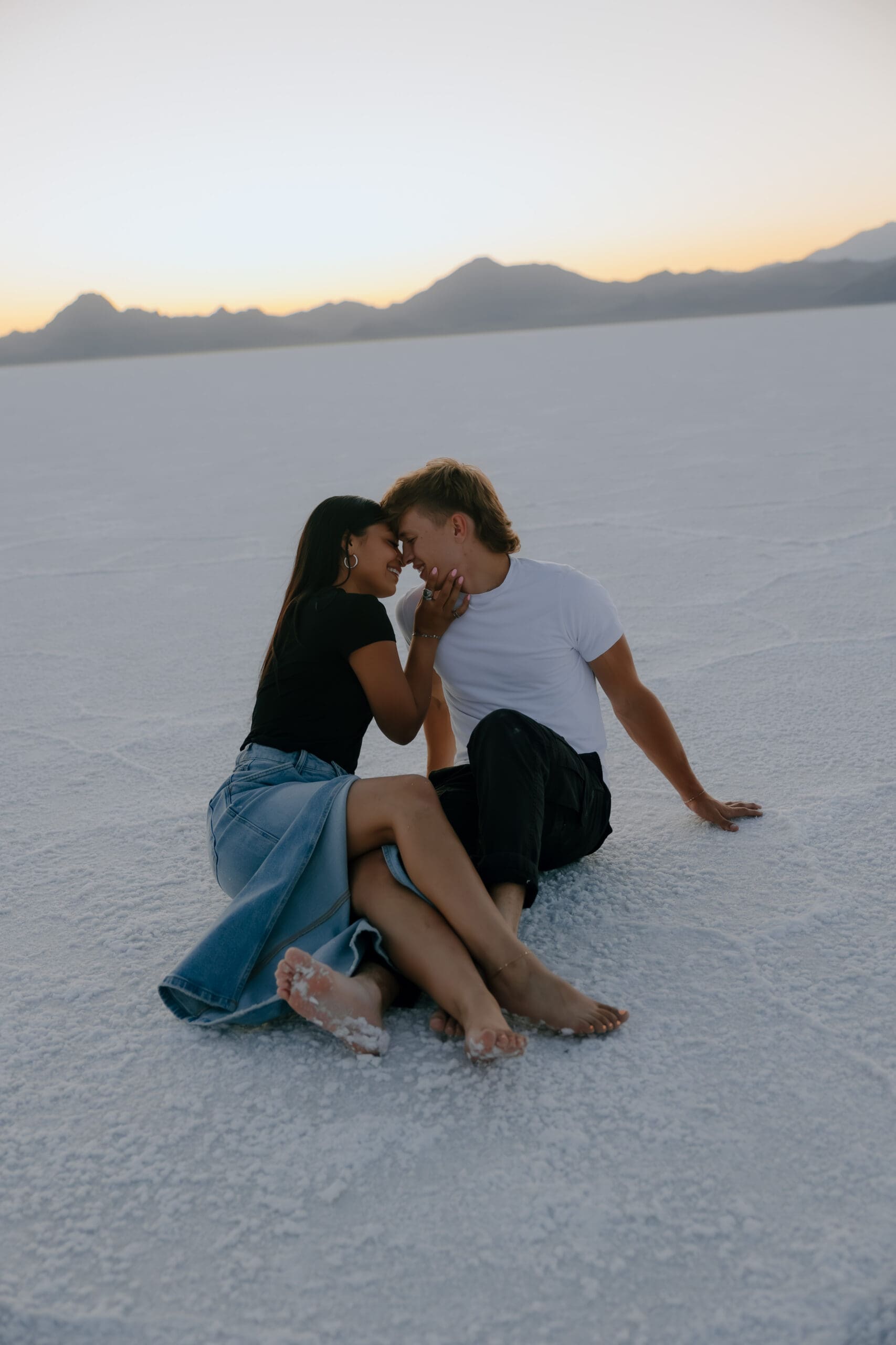 couple pose in the Salt Flats during their Southern Utah engagement photoshoot