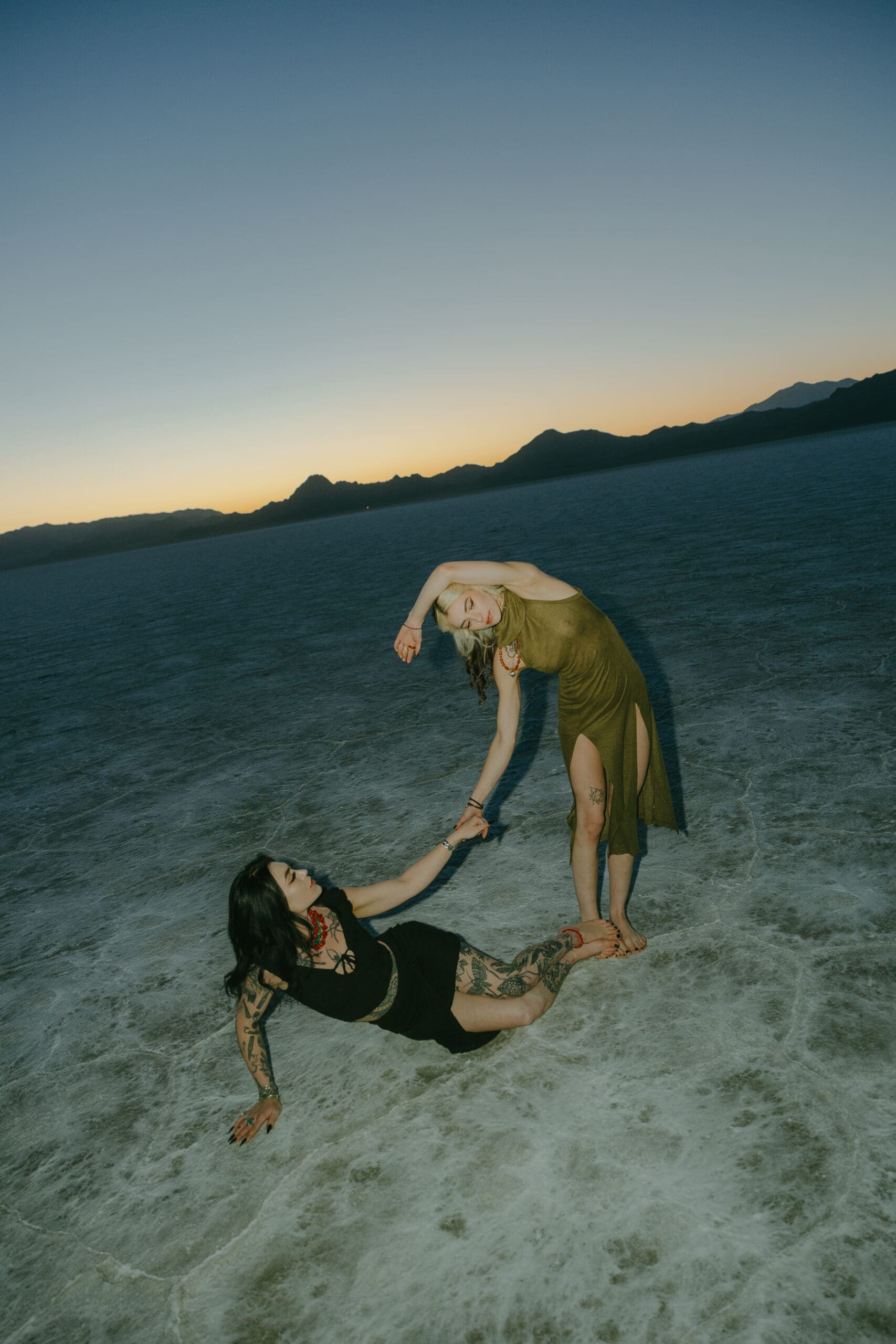 couple pose in the Salt Flats during their Southern Utah engagement photoshoot