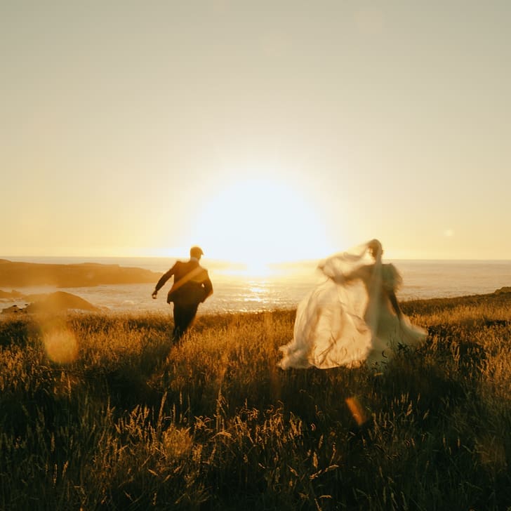 stunning couple run and have fun on the California coast during their Mendocino California Couples Photos 