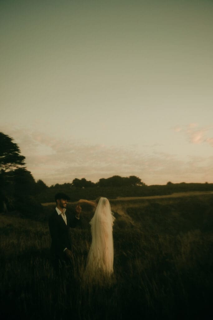 beautiful couple share intimate moments together on the stunning California coast