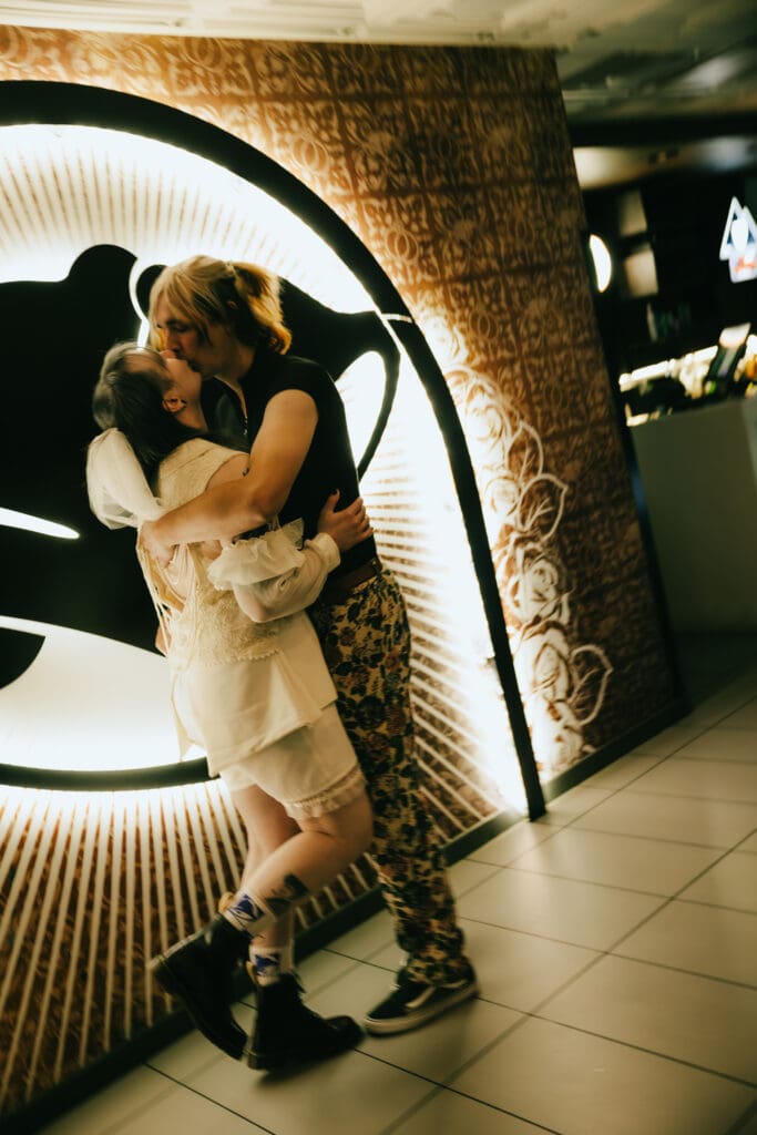 bride and groom share a kiss at their taco bell wedding vegas