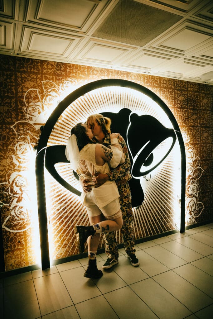 bride and groom share a kiss at their taco bell wedding vegas