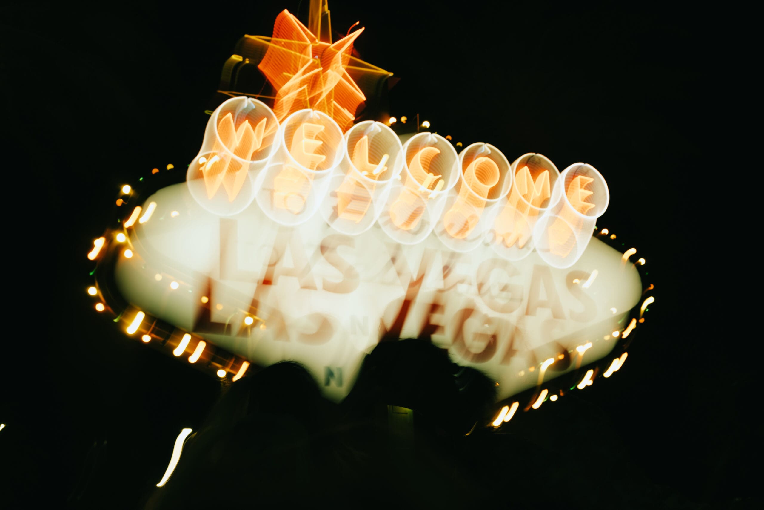 classic Las Vegas neon sign stands in the desert darkness