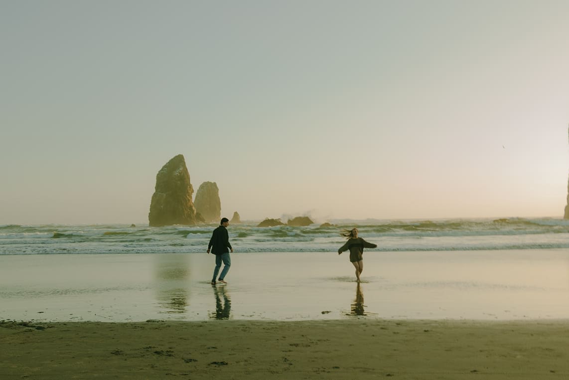 stunning couple share loving moments on the beach during their couples shoot
