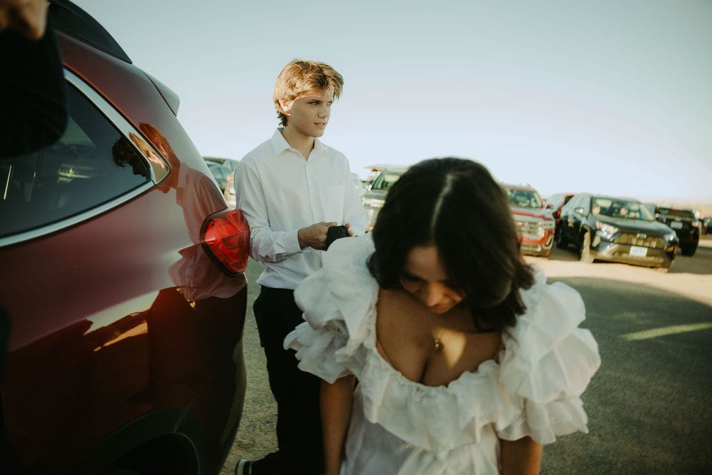 bride and groom enter the car ready to head to their elopement ceremony