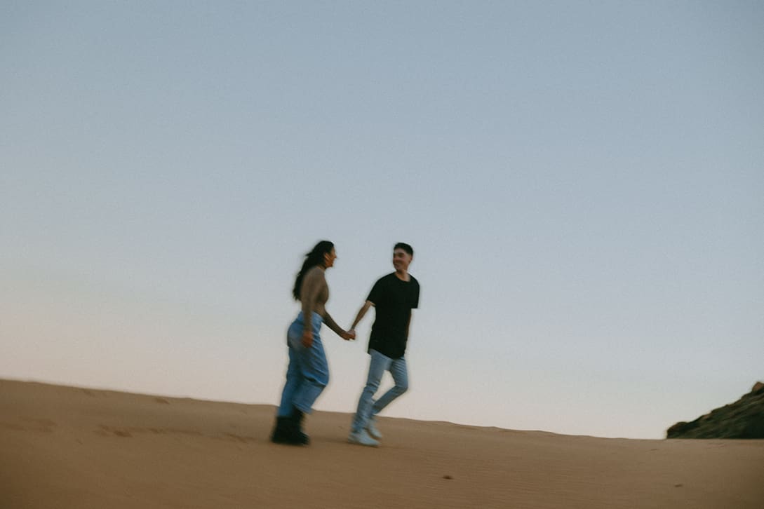 stunning couple walk together holding hands during their Southern Utah elopement