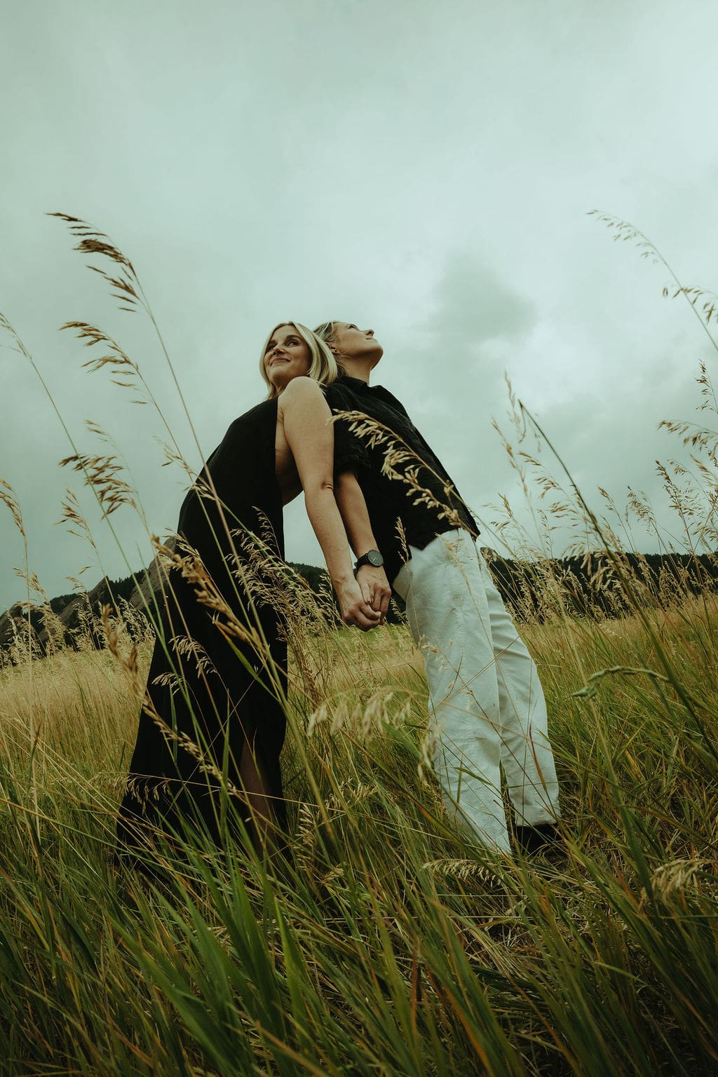couple pose together in a Utah field