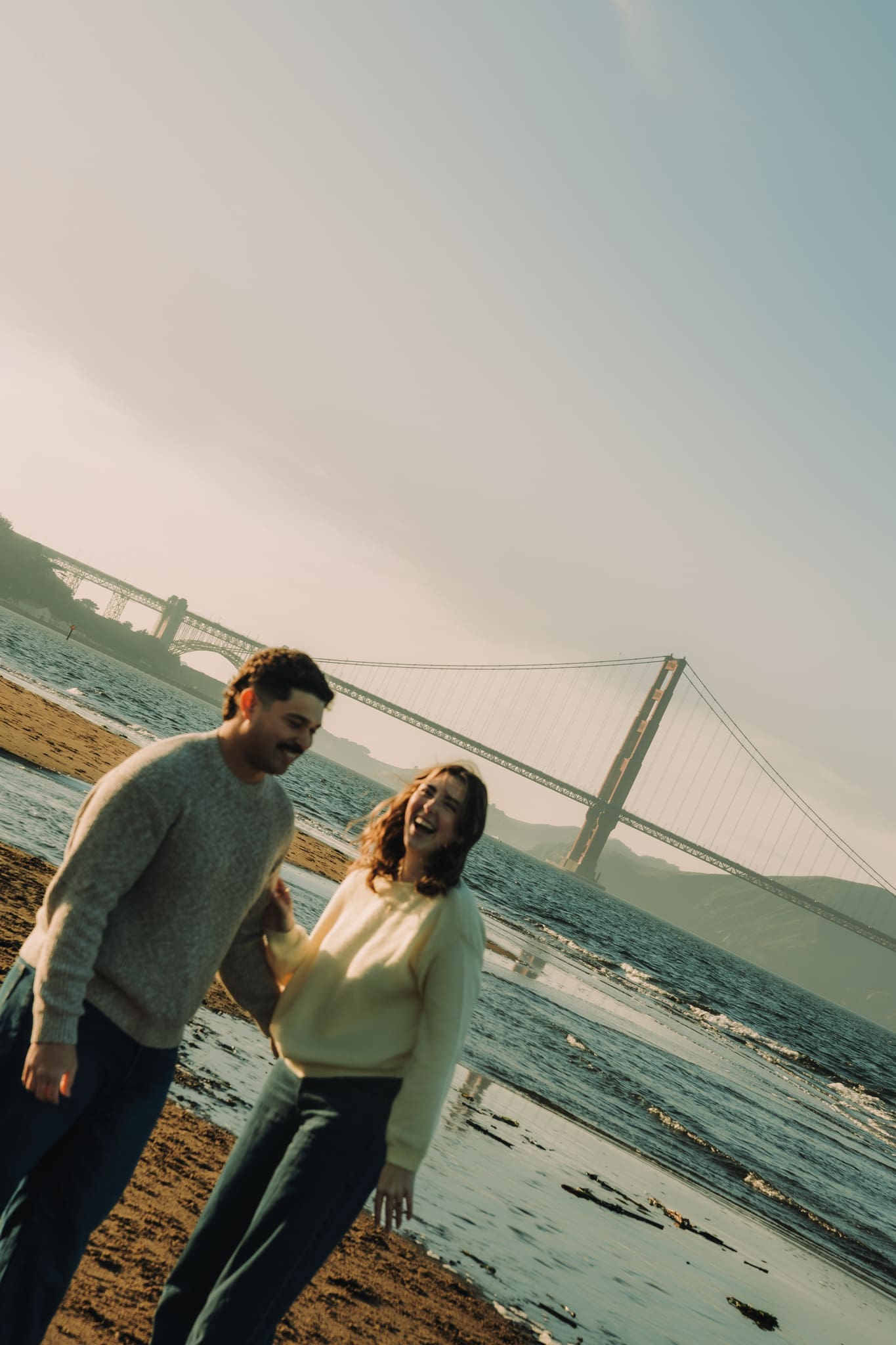 adventure couples session in front of the golden gate bridge