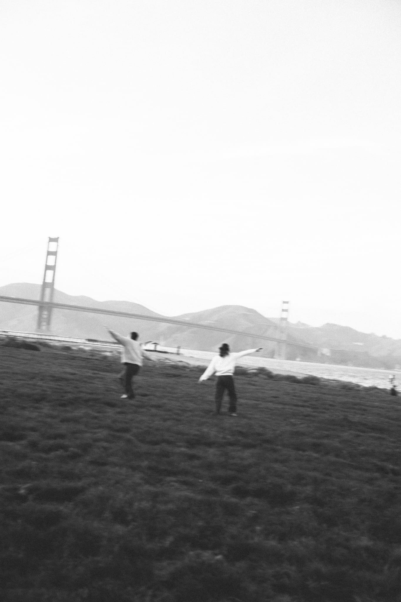 adventure couples session in front of the golden gate bridge