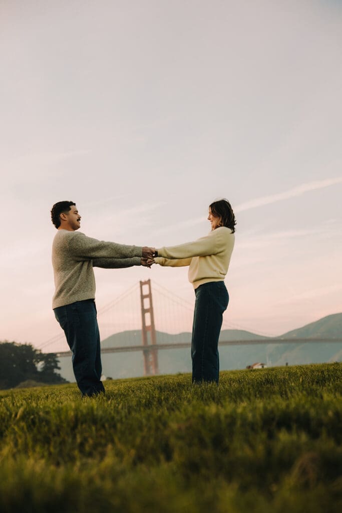 adventure couples session in front of the golden gate bridge