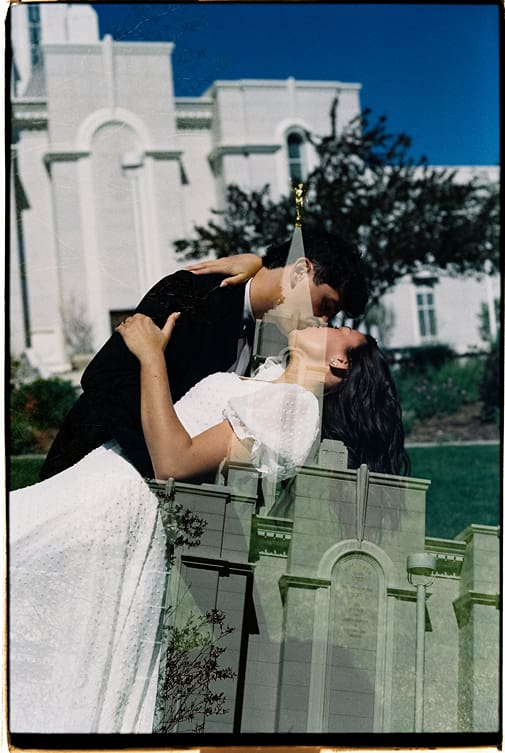 unique photo of the bride and groom with the church faded into the background